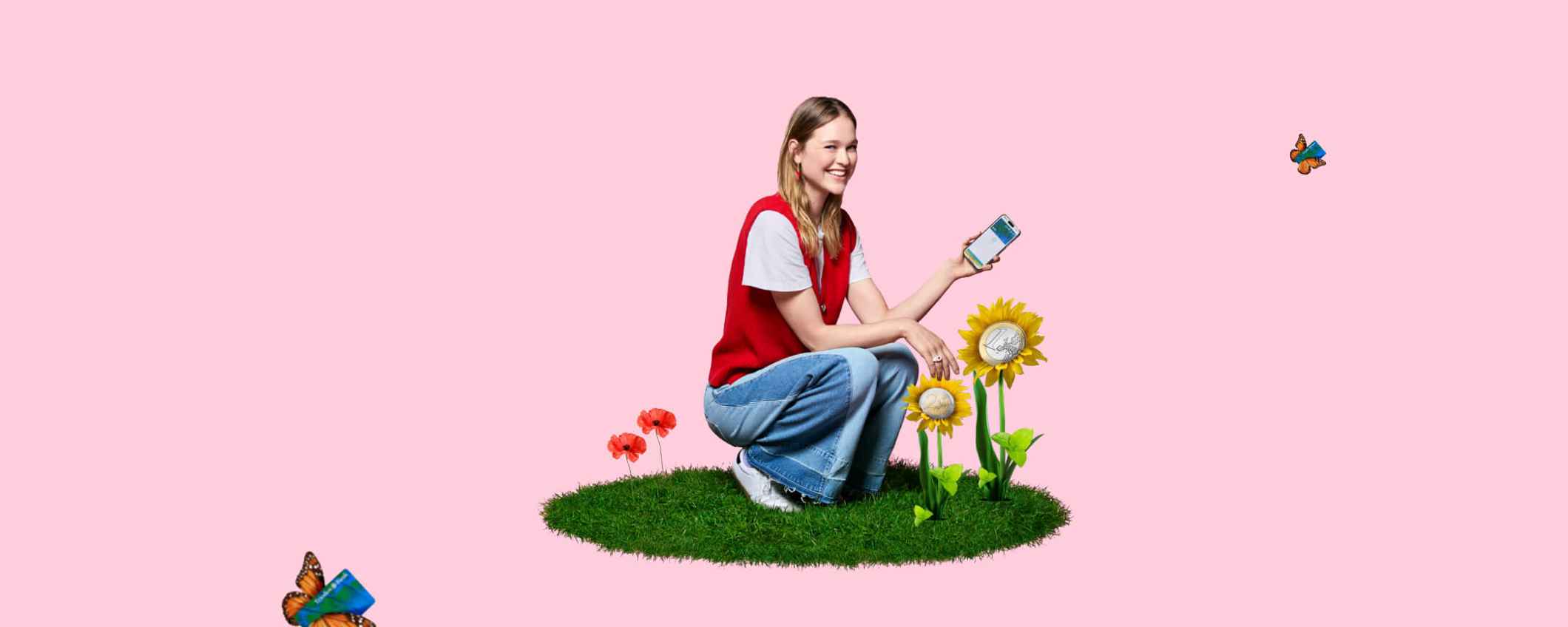 Een jongevrouw hurkt in het gras met een telefoon in haar hand